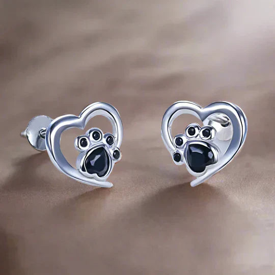 Nina - cardiac paw earpluged with black silver