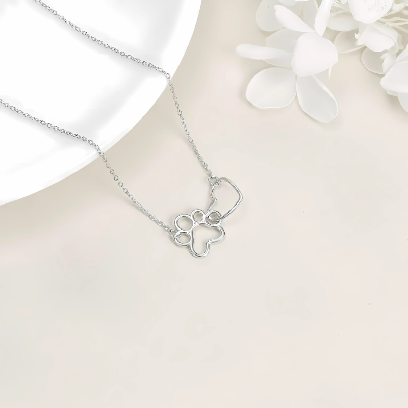 Siarah - Silver paw necklace with heart-shaped crystal pendant
