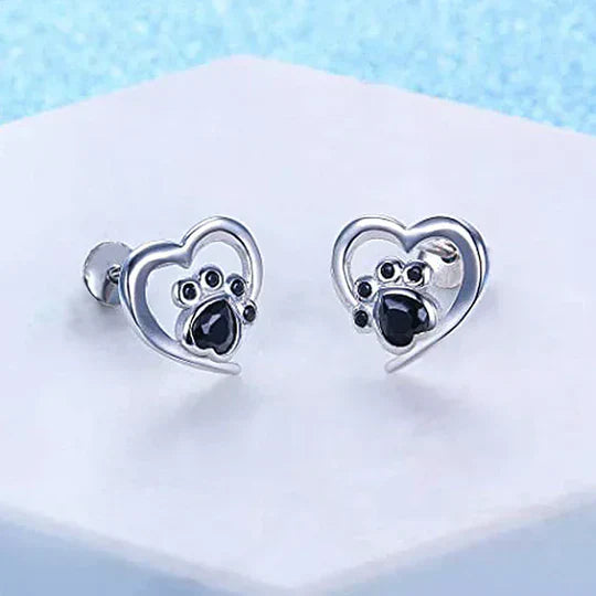 Nina - cardiac paw earpluged with black silver